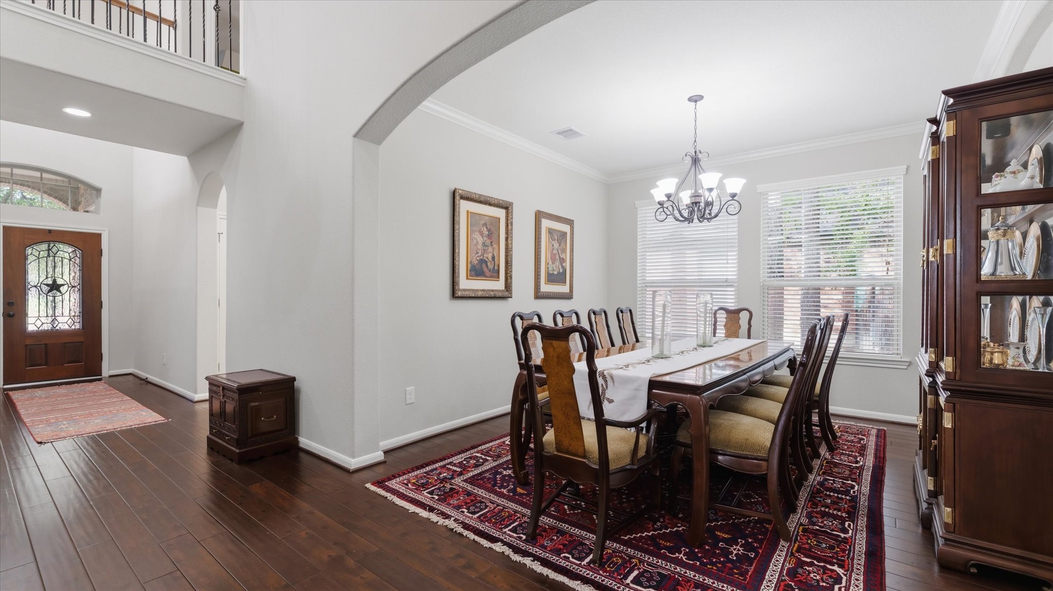 14 Painted Post Place Spring, TX 77389 - Photo 8 of 43 a view of a dining room with furniture and a chandelier