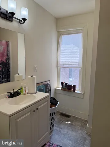a kitchen with a sink cabinets and window