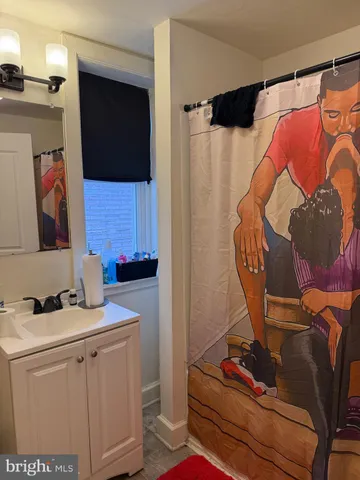 a bathroom with a sink toilet and mirror