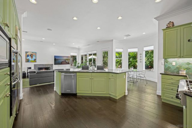 a view of a house with a wooden fence