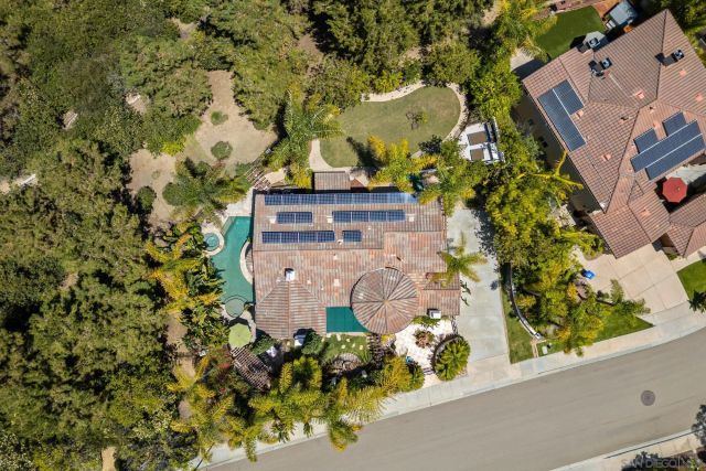 a room with pool table and windows