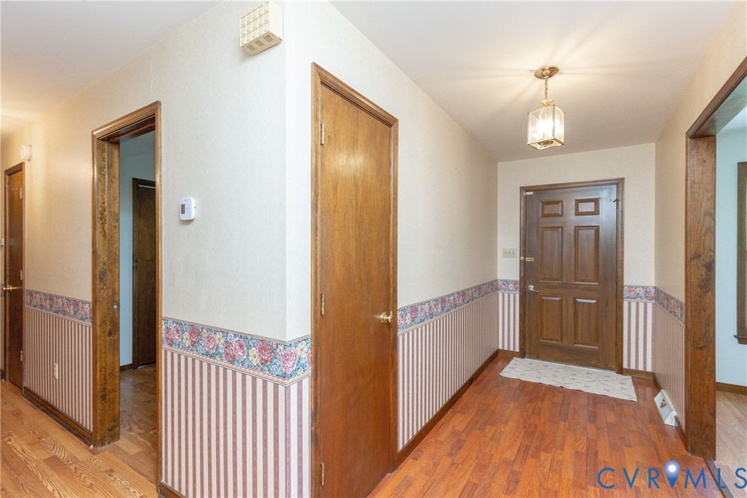 617 Rebel Ridge Road Colonial Heights, VA 23834 - Photo 13 of 49 a view of a hallway view with wooden floor and staircase