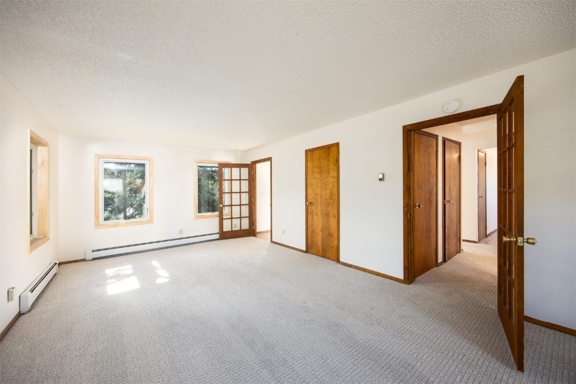420 Reese Road Silverthorne, CO 80498 - Photo 11 of 50 an empty room with windows and closet