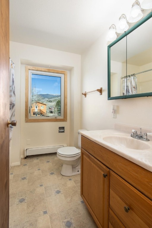 420 Reese Road Silverthorne, CO 80498 - Photo 13 of 50 a bathroom with a granite countertop sink mirror vanity and toilet