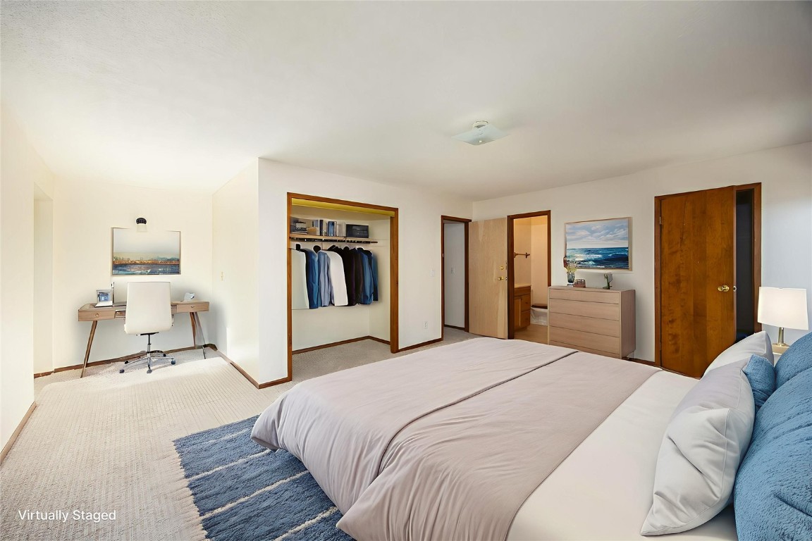 420 Reese Road Silverthorne, CO 80498 - Photo 15 of 50 a spacious bedroom with a bed and a refrigerator