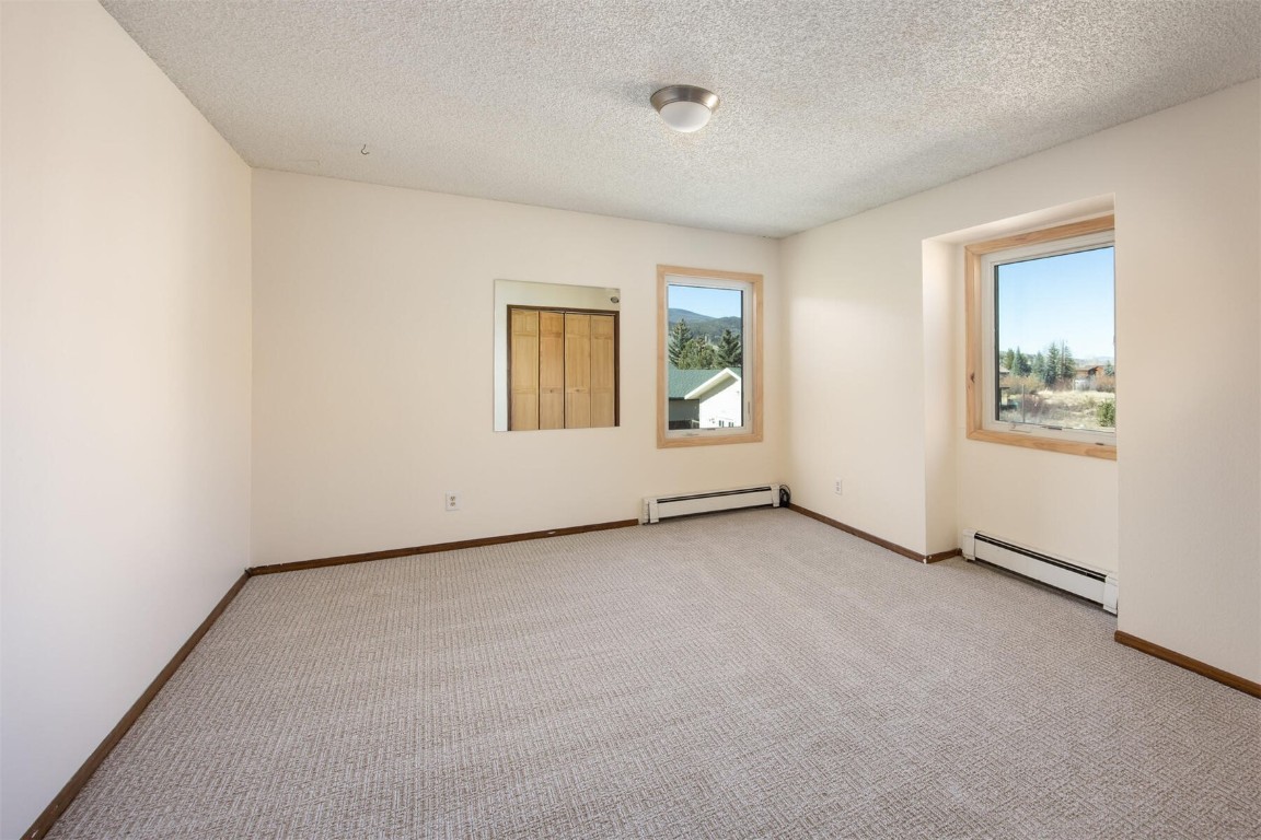 420 Reese Road Silverthorne, CO 80498 - Photo 22 of 50 an empty room with windows