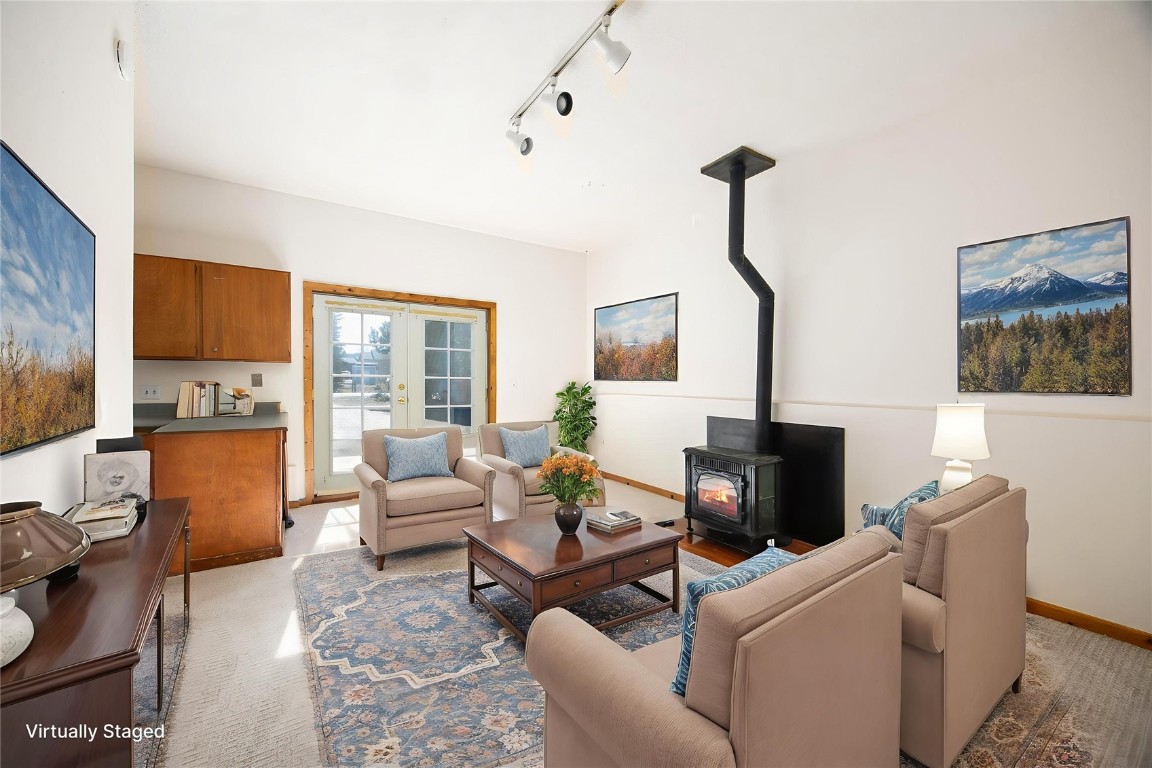 420 Reese Road Silverthorne, CO 80498 - Photo 32 of 50 a living room with furniture a fireplace and a flat screen tv