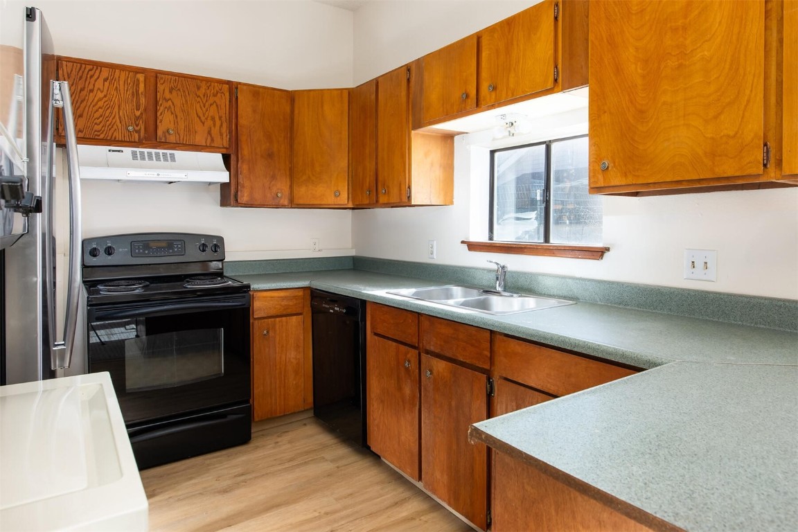 420 Reese Road Silverthorne, CO 80498 - Photo 34 of 50 a kitchen with stainless steel appliances a stove a sink and a microwave