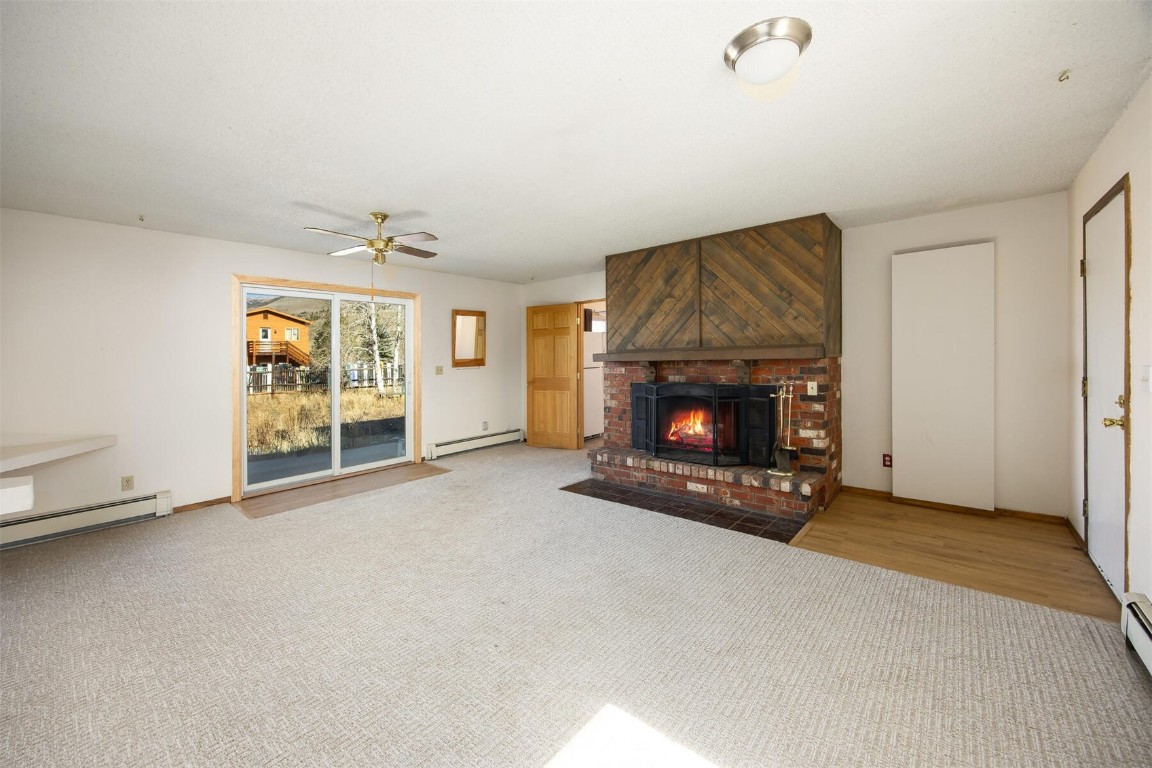 420 Reese Road Silverthorne, CO 80498 - Photo 4 of 50 a view of an empty room with a fireplace