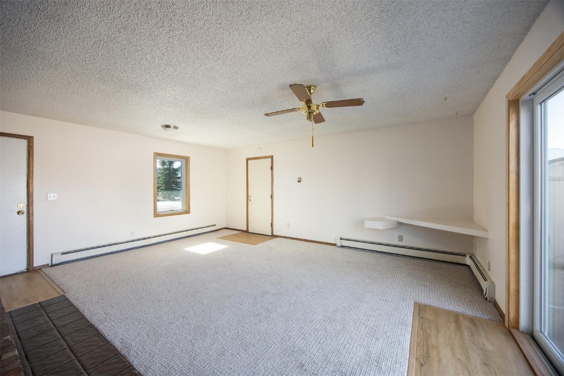 420 Reese Road Silverthorne, CO 80498 - Photo 6 of 50 an empty room with a empty space and windows