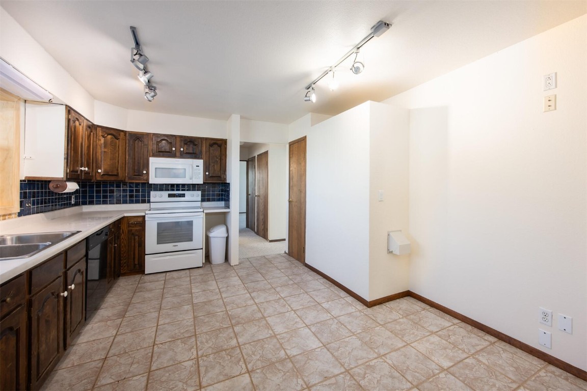 420 Reese Road Silverthorne, CO 80498 - Photo 9 of 50 a large kitchen with cabinets and stainless steel appliances