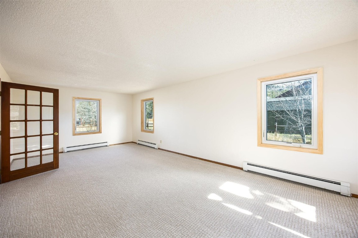 420 Reese Road Silverthorne, CO 80498 - Photo 10 of 50 an empty room with windows