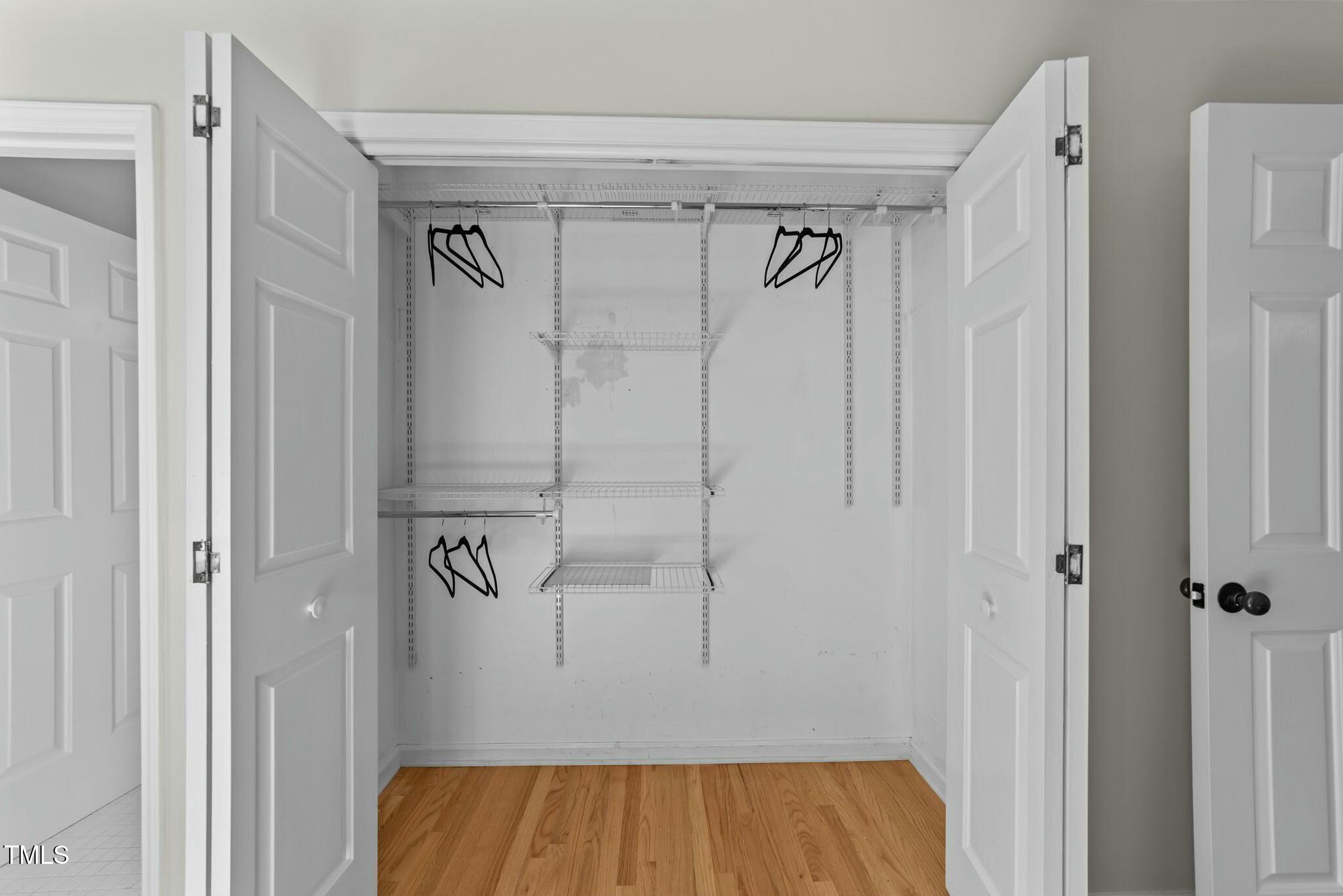 5809 Heatherbrook Circle Raleigh, NC 27612 - Photo 21 of 42 Main bedroom closet with built in shelving.