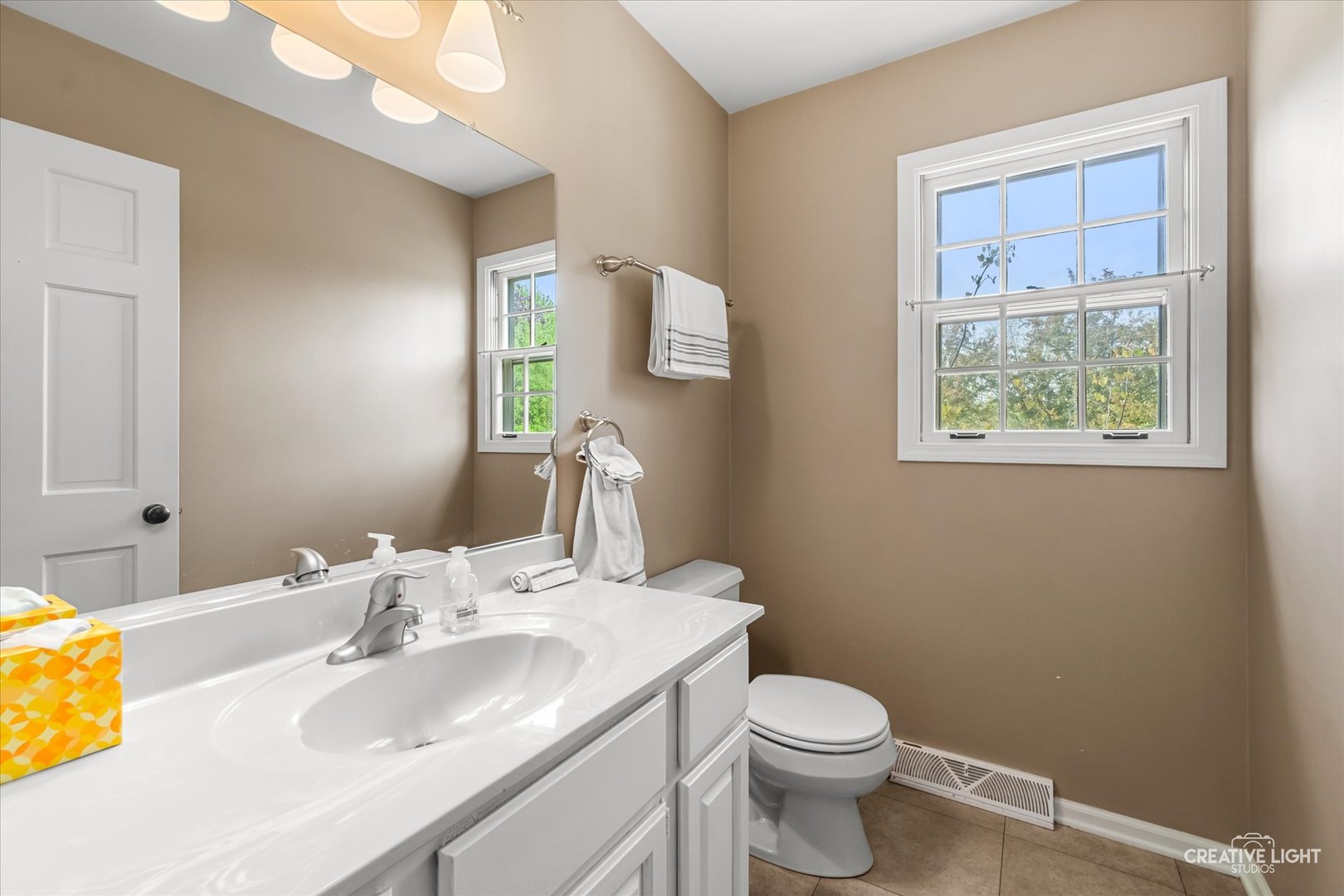 27W343 Churchill Road Winfield, IL 60190 - Photo 23 of 40 a bathroom with a sink toilet and a mirror