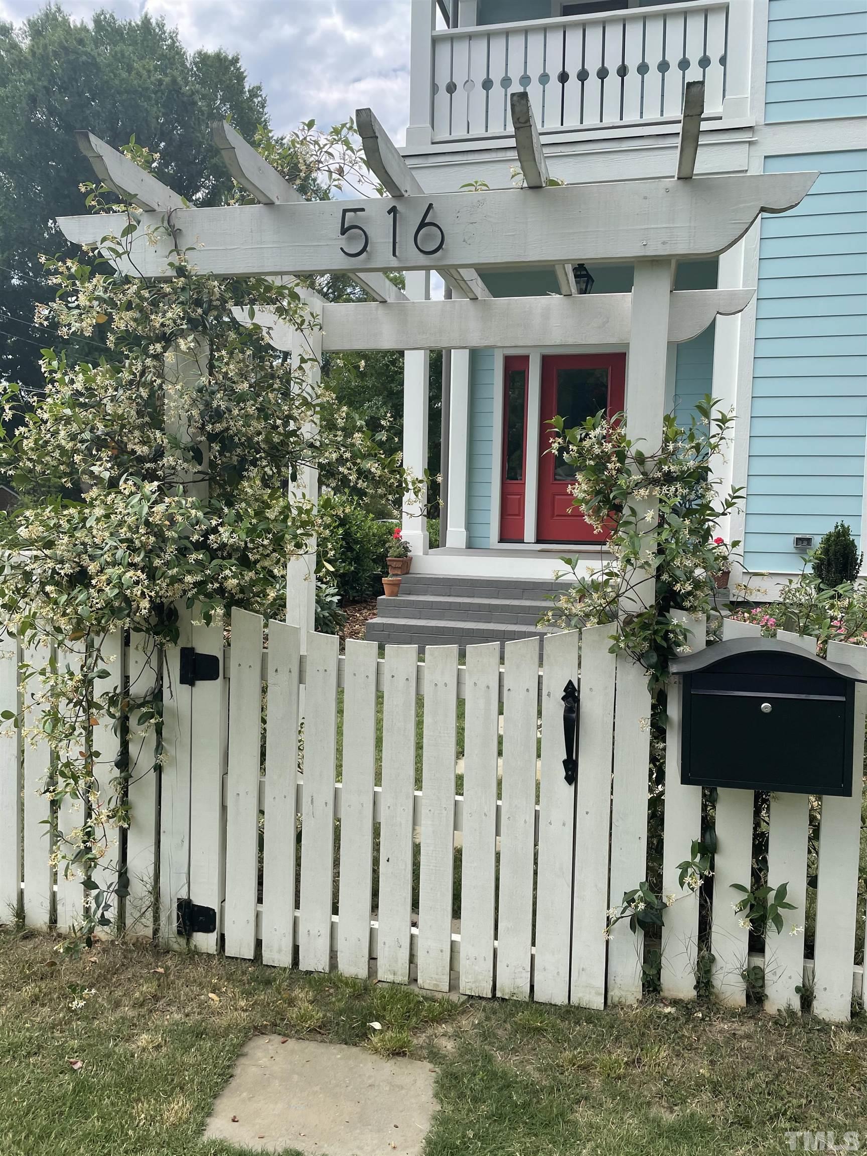 516 Sasser Street Raleigh, NC 27604 - Photo 2 of 30 a front view of a building with a garden