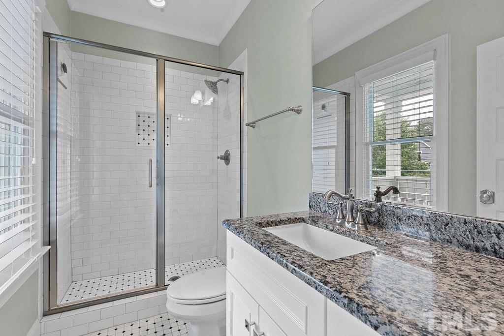 516 Sasser Street Raleigh, NC 27604 - Photo 20 of 30 a bathroom with a granite countertop sink toilet and shower