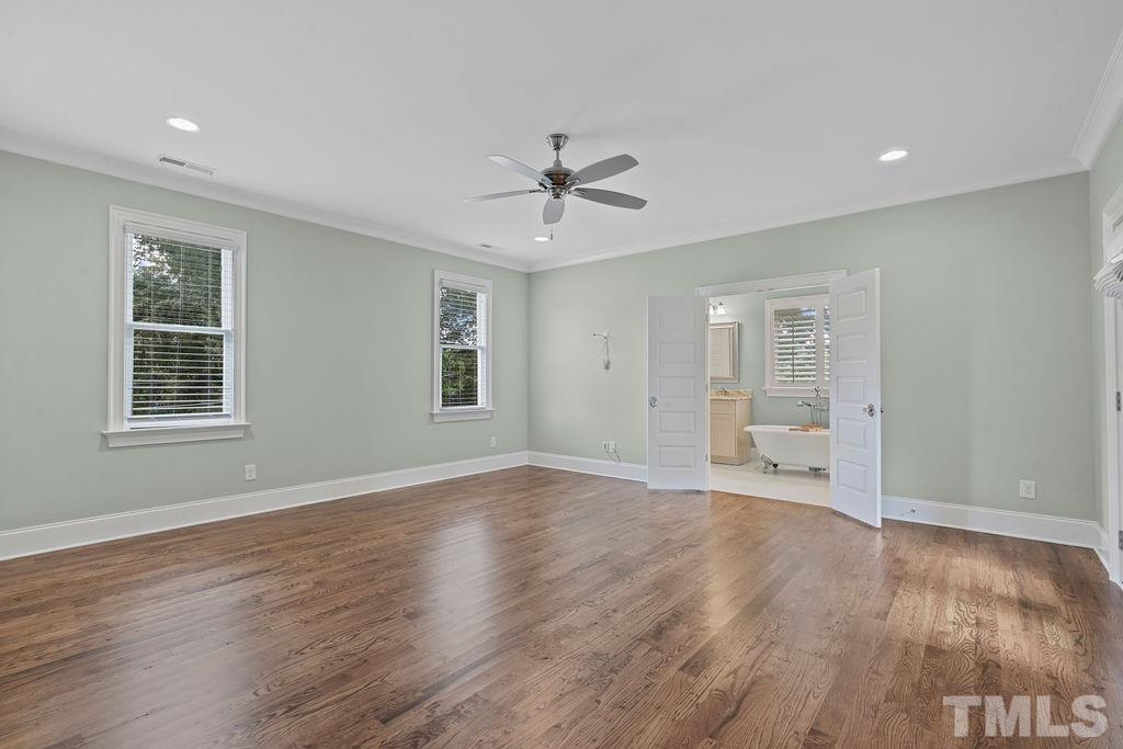 516 Sasser Street Raleigh, NC 27604 - Photo 23 of 30 a view of an empty room with a window and wooden floor