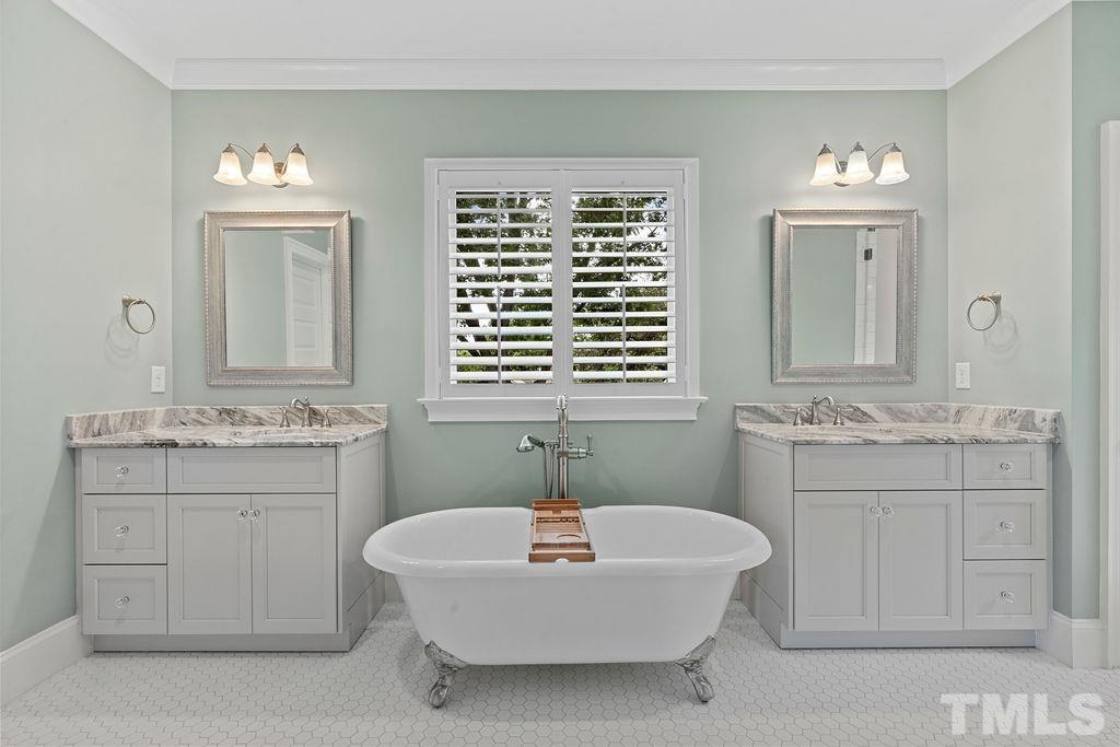 516 Sasser Street Raleigh, NC 27604 - Photo 24 of 30 a bathroom with a sink tub and a window