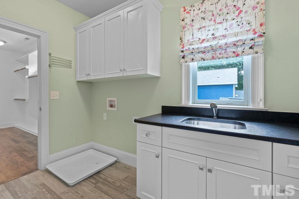516 Sasser Street Raleigh, NC 27604 - Photo 26 of 30 a bathroom with a sink and a mirror