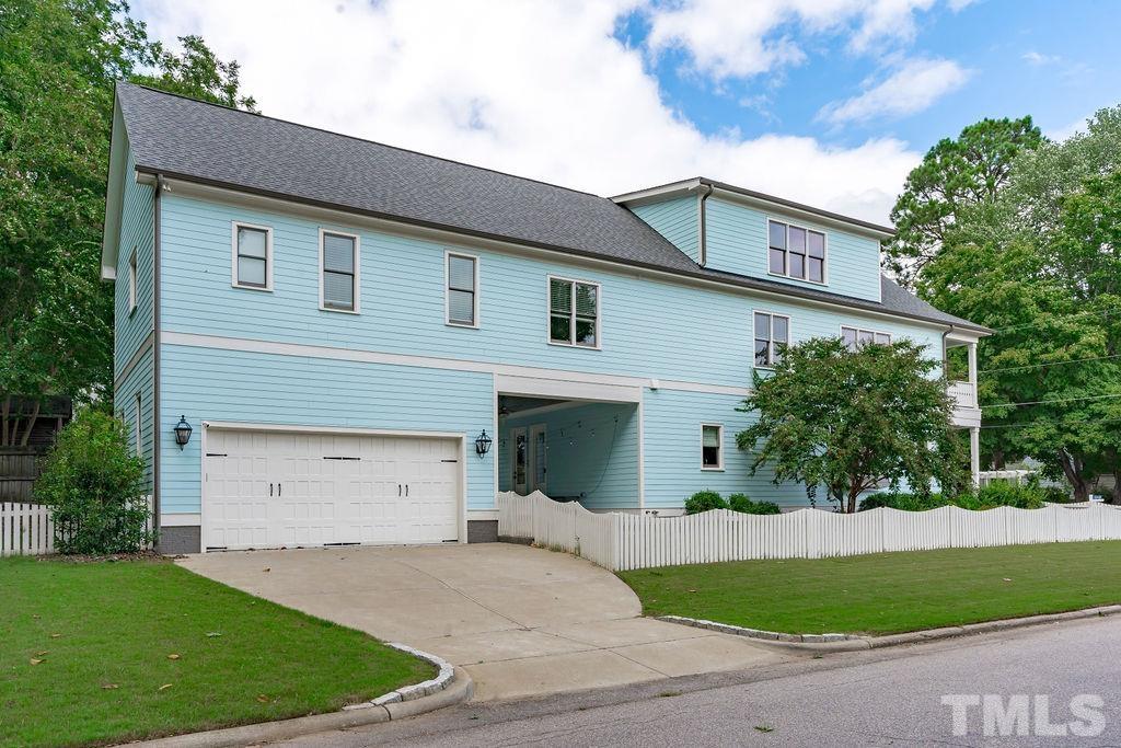 516 Sasser Street Raleigh, NC 27604 - Photo 29 of 30 a front view of a house with a yard and garage
