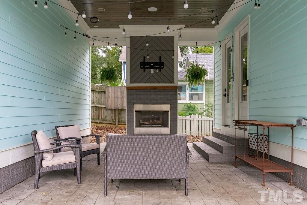 516 Sasser Street Raleigh, NC 27604 - Photo 30 of 30 a living room with furniture and a fireplace