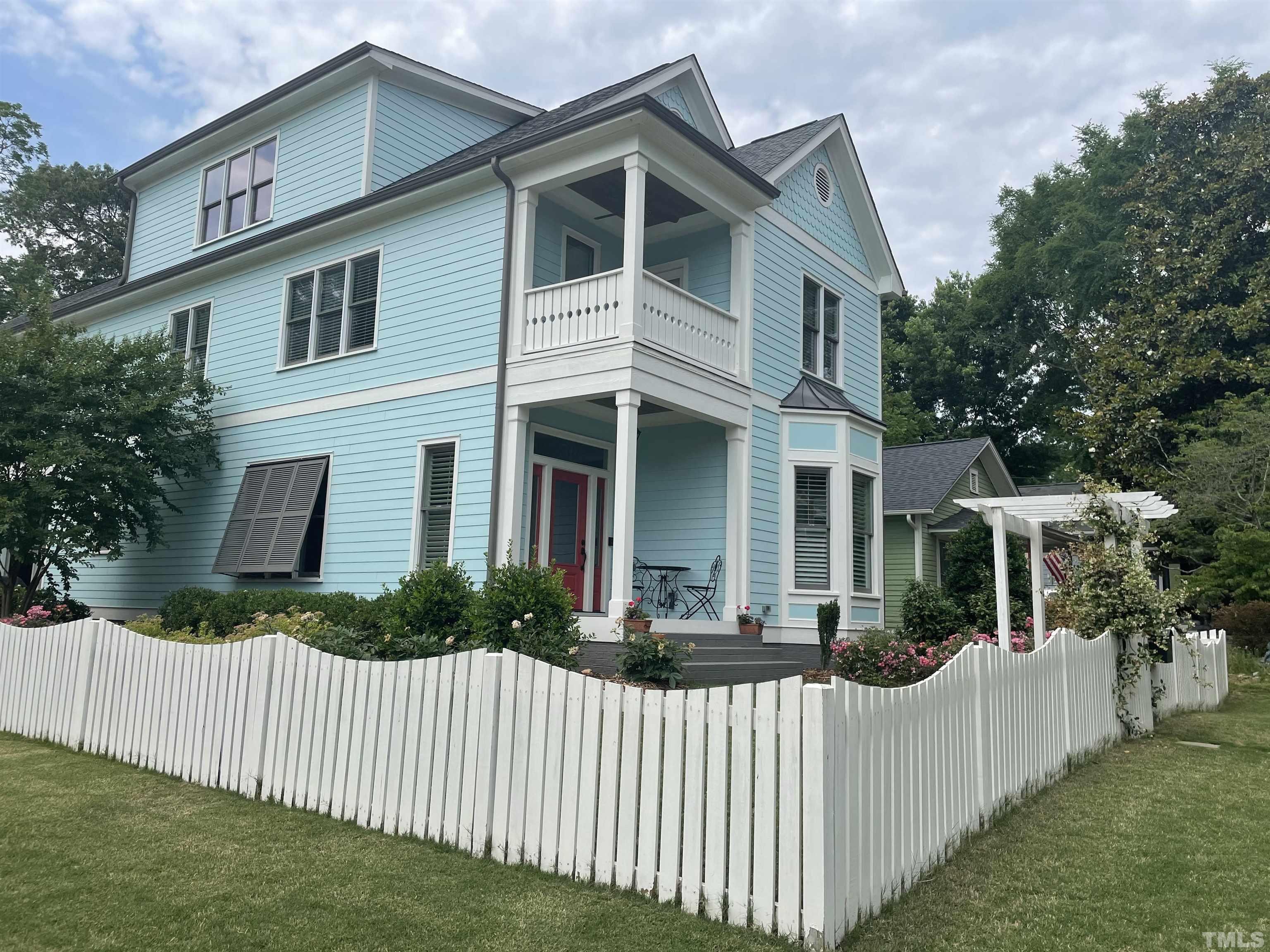 516 Sasser Street Raleigh, NC 27604 - Photo 4 of 30 a front view of a house with a yard
