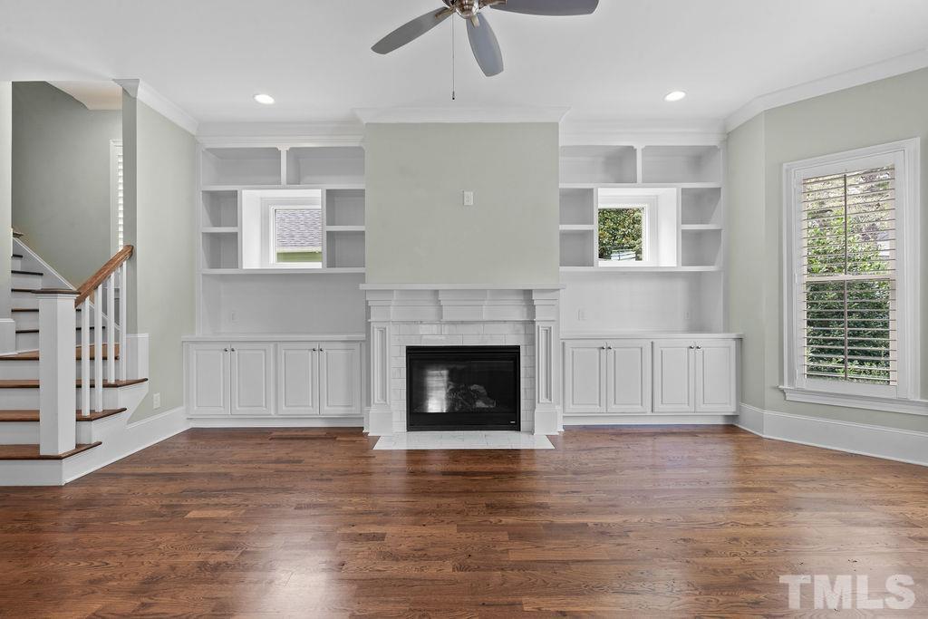 516 Sasser Street Raleigh, NC 27604 - Photo 6 of 30 a living room with furniture and a fireplace