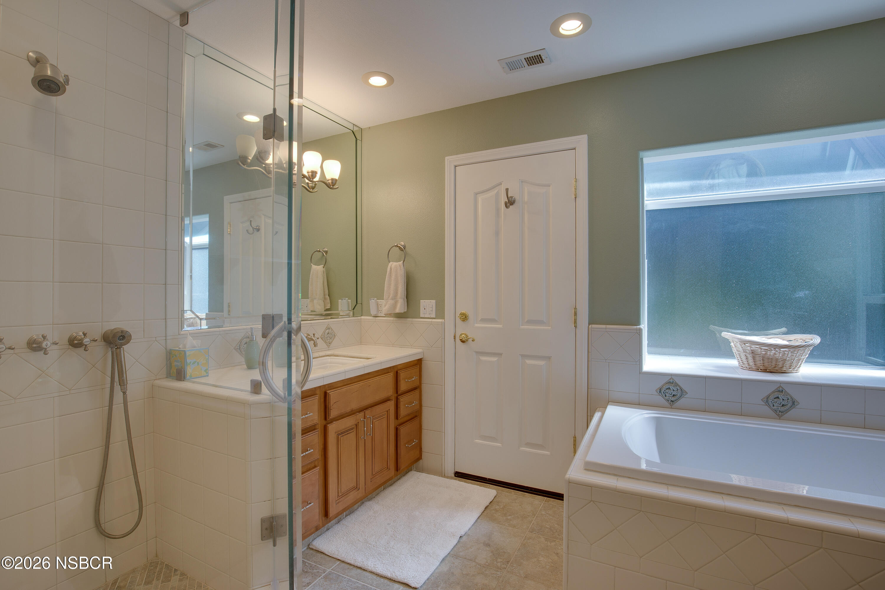 850 Fredensborg Canyon Road Solvang, CA 93463 - Photo 16 of 26 a bathroom with a sink a toilet and shower