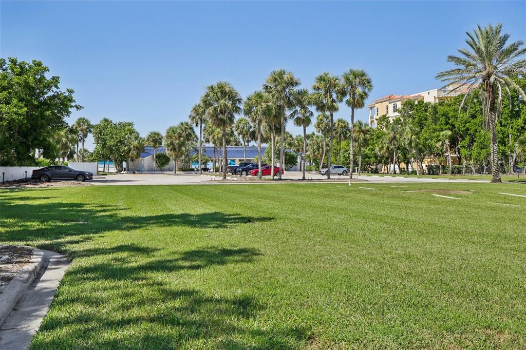 3390 Bayou Sound Longboat Key, FL 34228 - Photo 48 of 59 a view of a park with trees and a sign