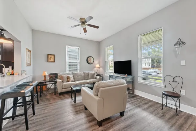 a living room with furniture and a flat screen tv