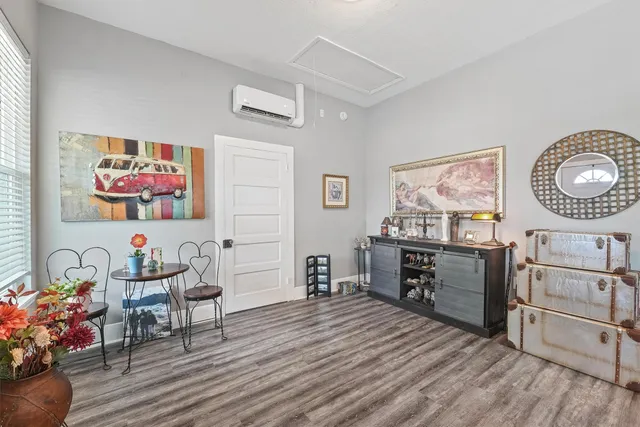 a view of a workspace with furniture cabinet and wooden floor