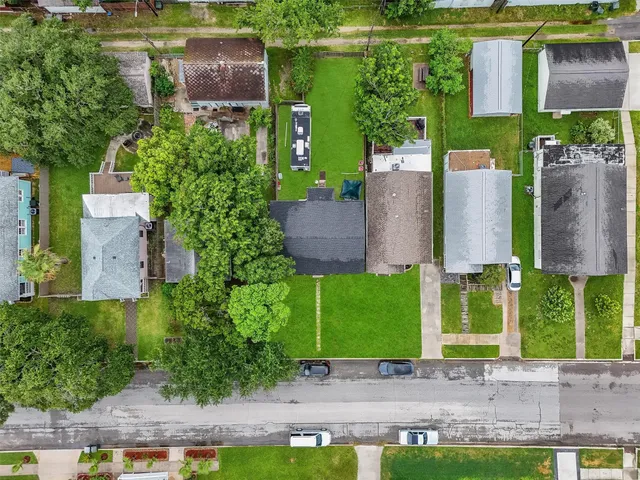 an aerial view of a house with a garden and plants