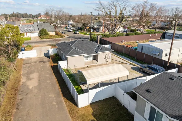 a house with a road and city view