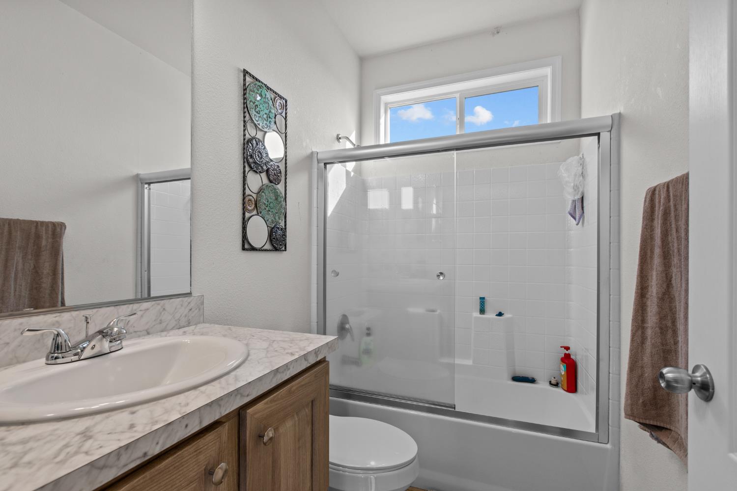 6228 Fowler Avenue Sacramento, CA 95828 - Photo 30 of 47 a bathroom with a granite countertop sink toilet and shower