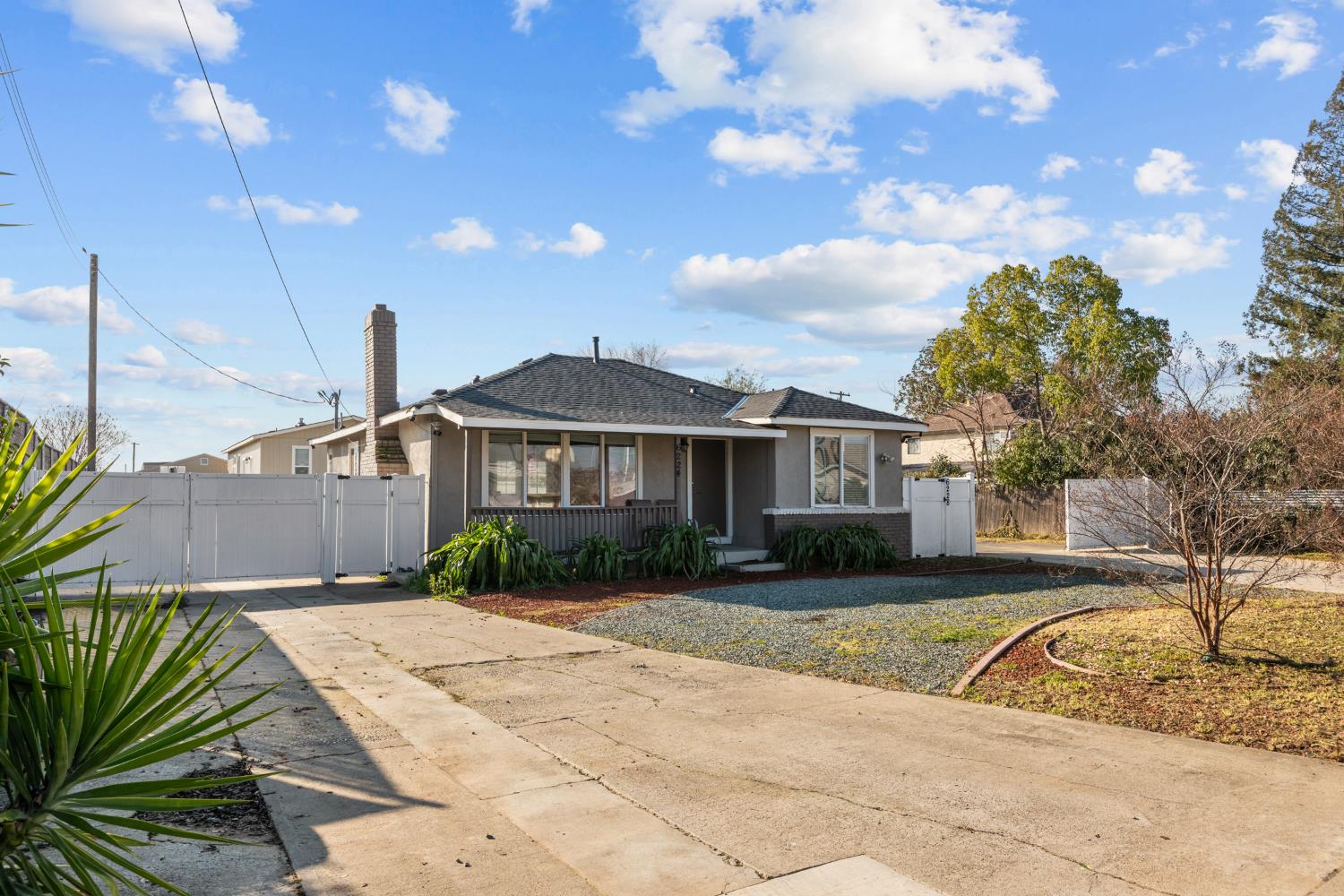 6228 Fowler Avenue Sacramento, CA 95828 - Photo 7 of 47 a front view of a house with garden