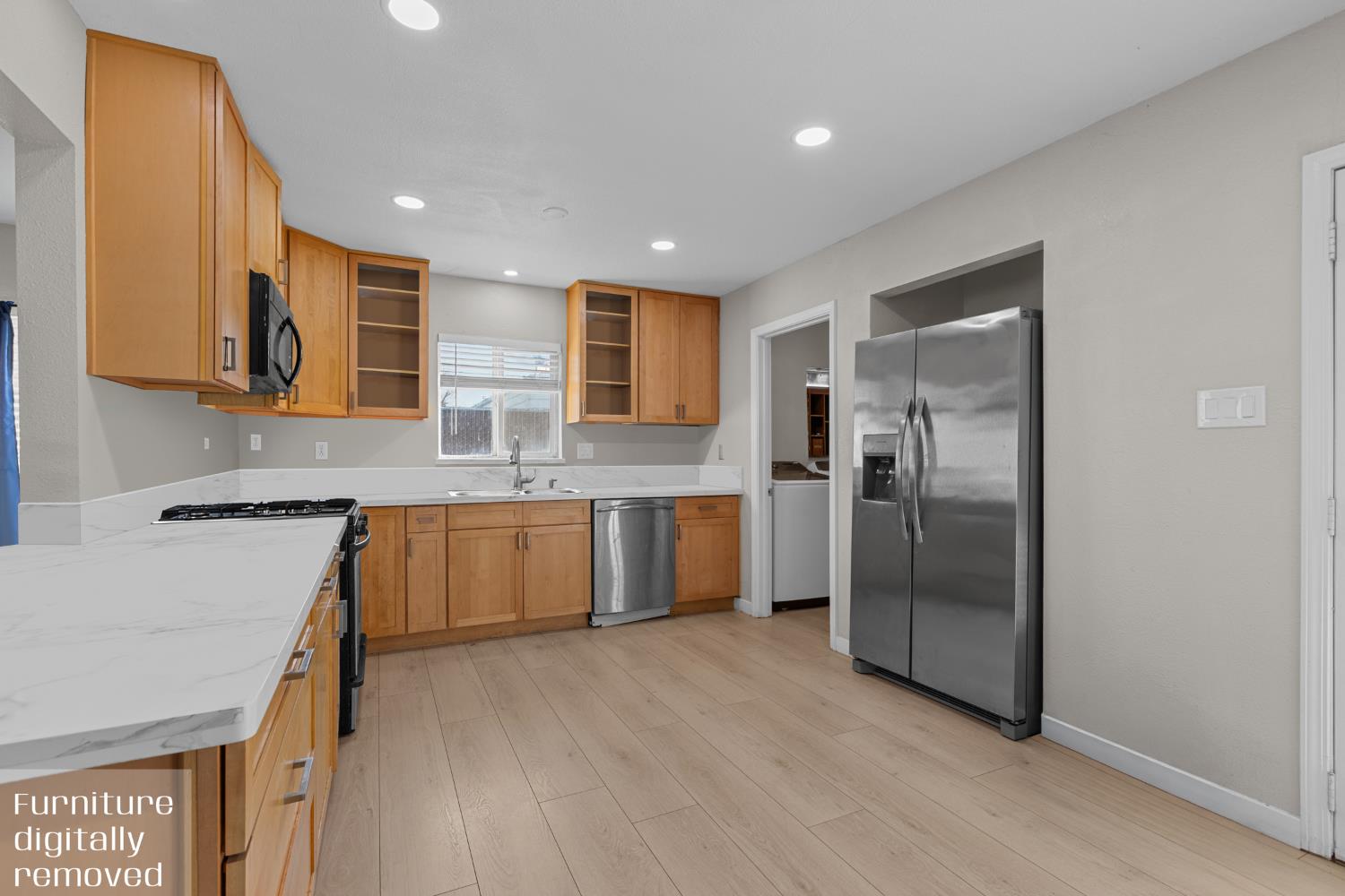 6228 Fowler Avenue Sacramento, CA 95828 - Photo 10 of 47 a kitchen with stainless steel appliances granite countertop a refrigerator and a sink