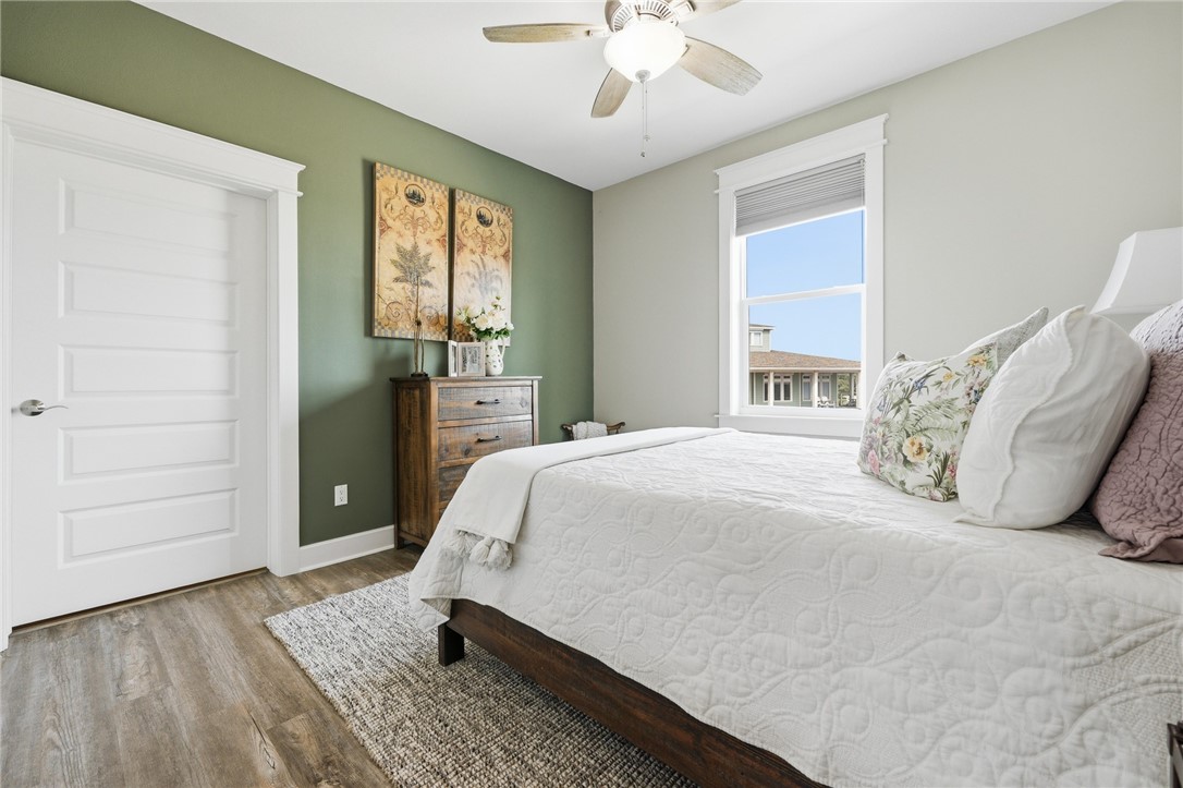 12 Sea Shell Shores Rockport, TX 78382 - Photo 25 of 40 a bedroom with a bed and wooden floor