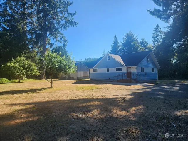 a house with trees in the background