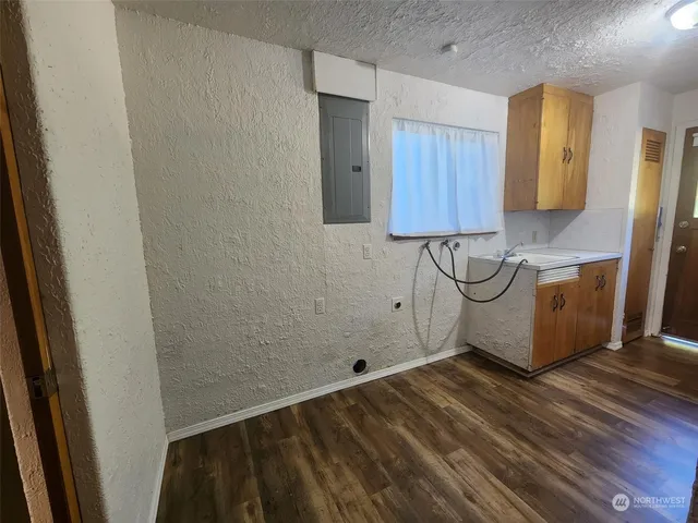 a view of a storage & utility room with a sink