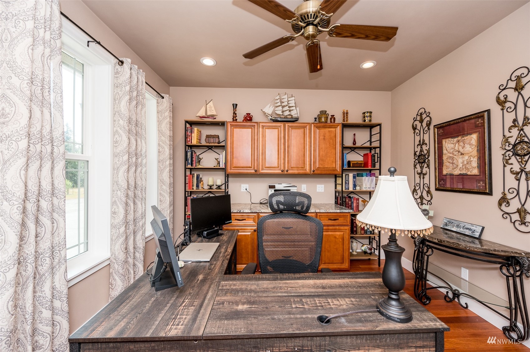 25920 80th Avenue East Graham, WA 98338 - Photo 14 of 40 a living room with furniture a flat screen tv and a floor to ceiling window