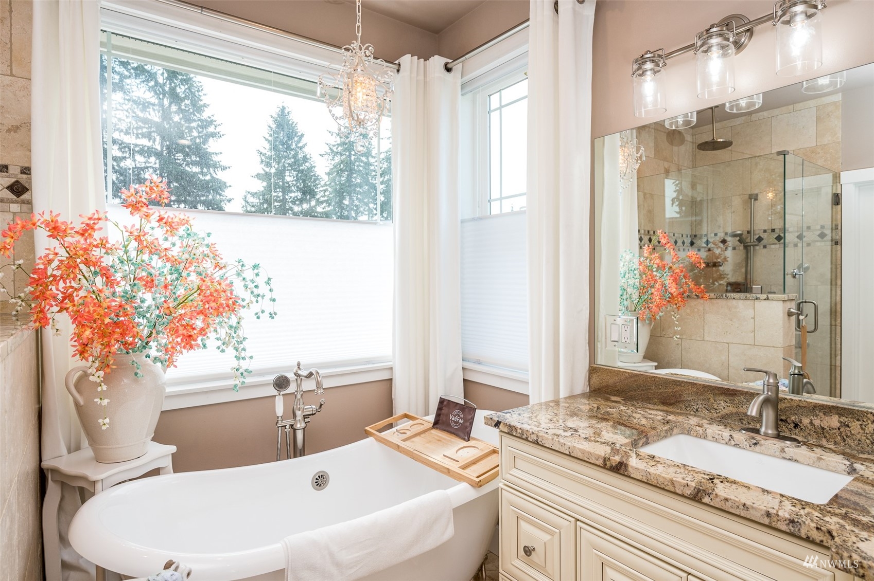25920 80th Avenue East Graham, WA 98338 - Photo 23 of 40 a bathroom with a sink and a mirror