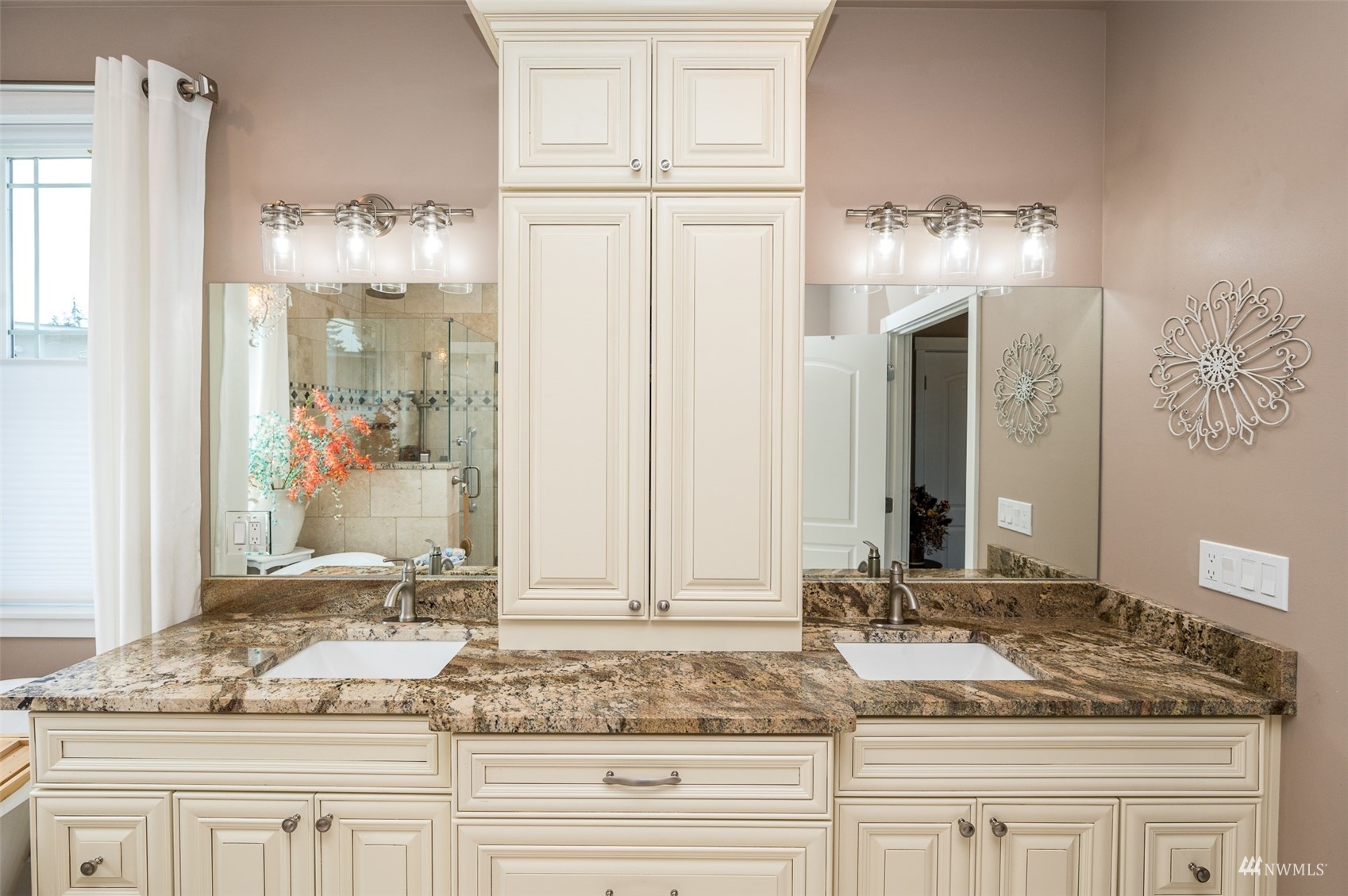 25920 80th Avenue East Graham, WA 98338 - Photo 24 of 40 a bathroom with a granite countertop sink and a mirror