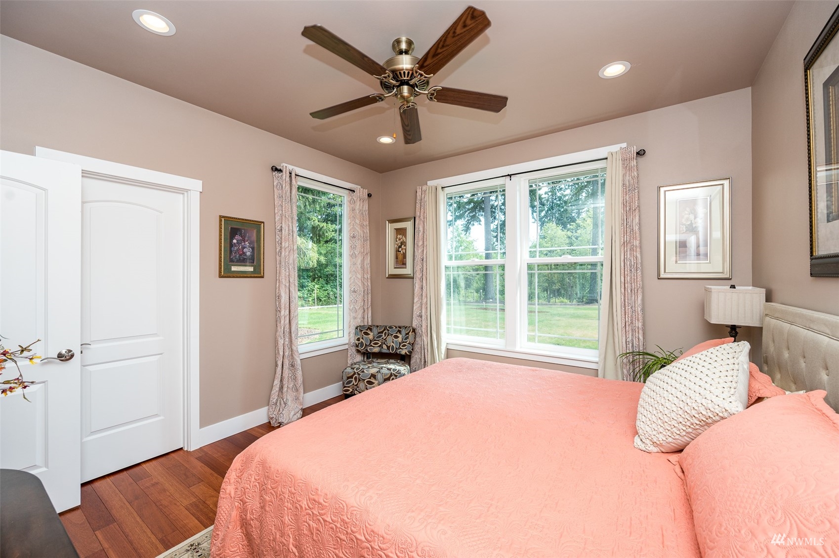 25920 80th Avenue East Graham, WA 98338 - Photo 25 of 40 a bedroom with a bed and a large window with outer view