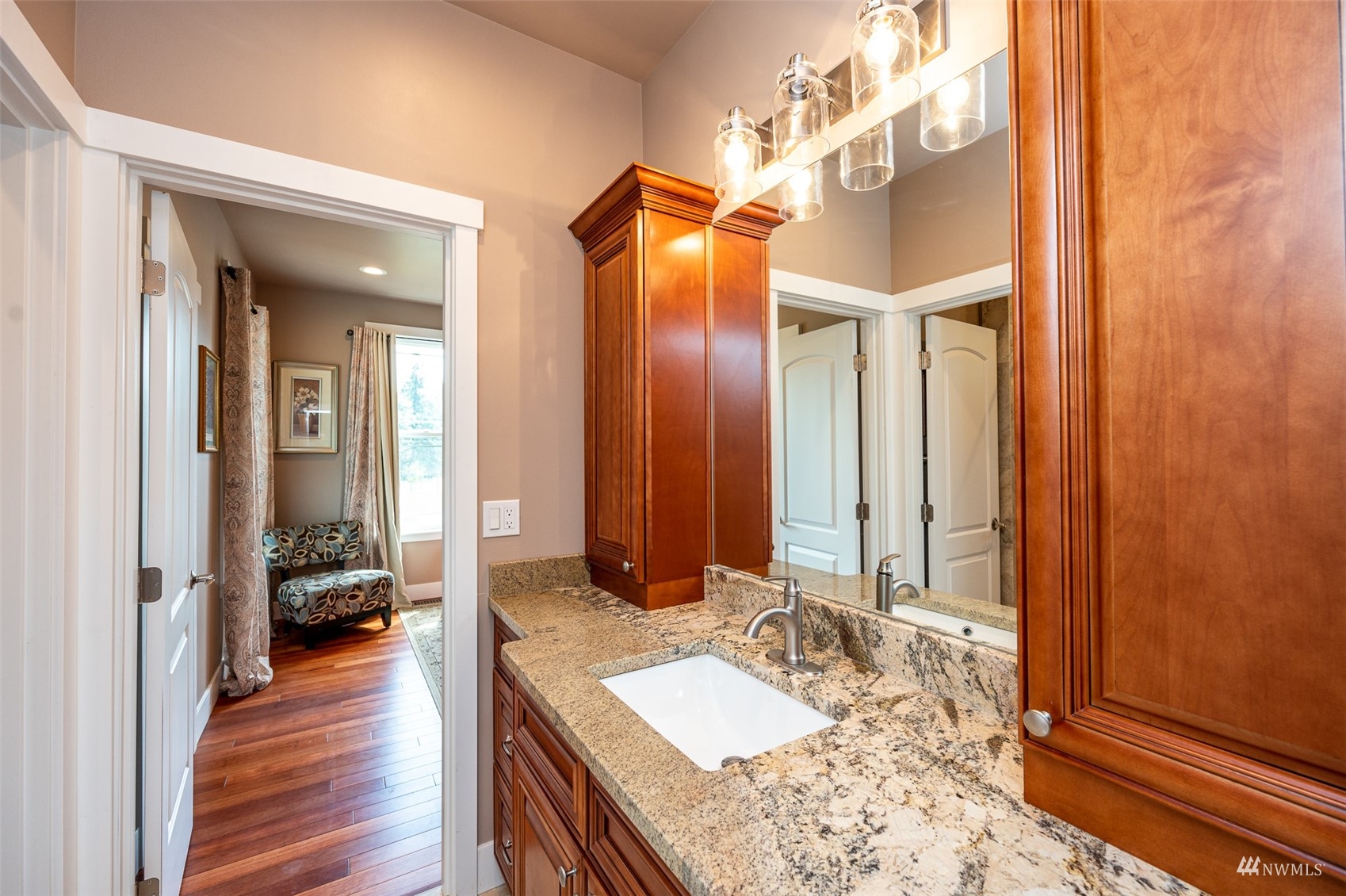 25920 80th Avenue East Graham, WA 98338 - Photo 26 of 40 a en suite bathroom with a granite countertop sink and a mirror