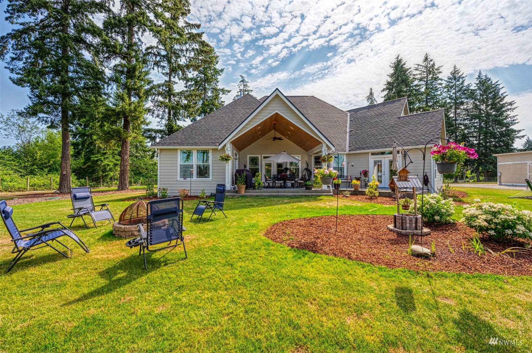 25920 80th Avenue East Graham, WA 98338 - Photo 32 of 40 a house view with swimming pool and garden space