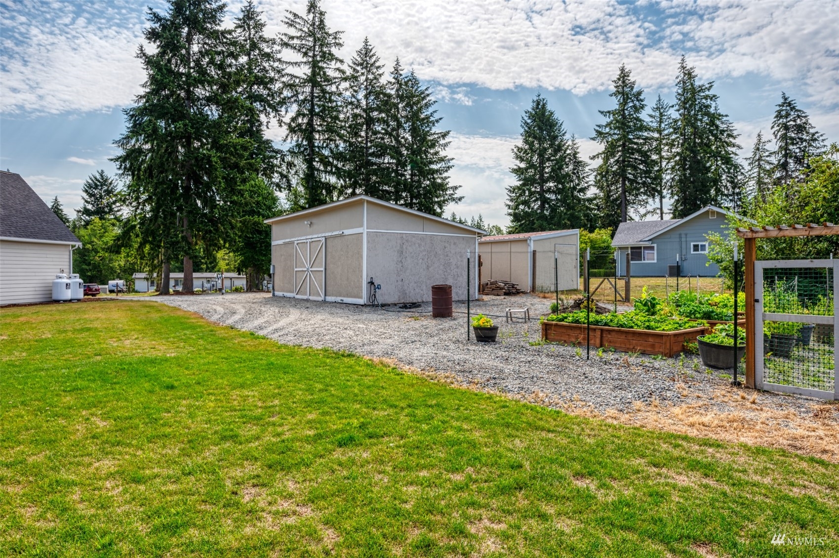 25920 80th Avenue East Graham, WA 98338 - Photo 35 of 40 a house view with a sitting space and garden