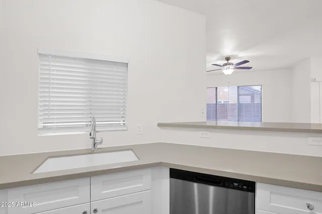 a kitchen with a sink and a window