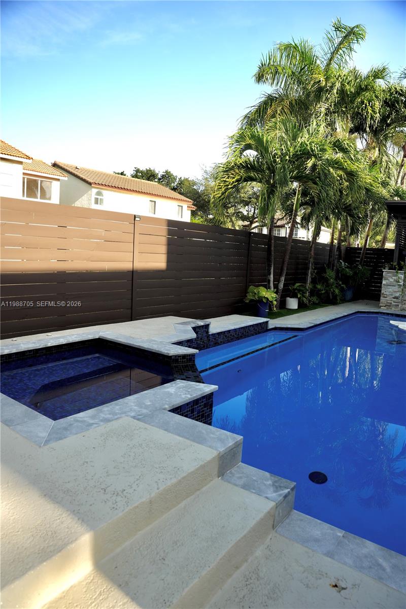 19262 Northwest 89th Avenue Hialeah, FL 33018 - Photo 20 of 20 a view of a swimming pool with a yard