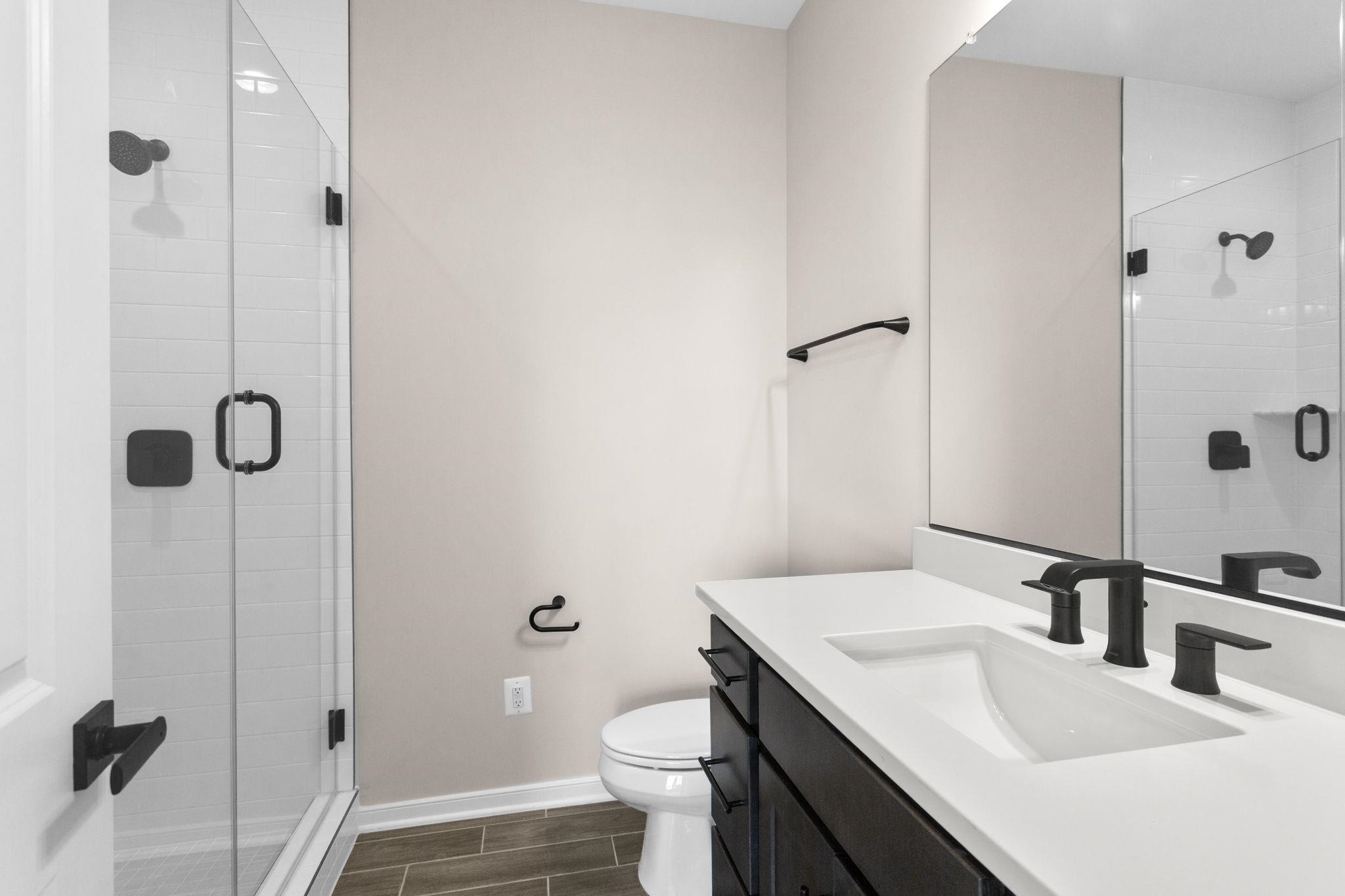 207 Scarlet Maple Lane, Unit 119 Bridgewater, VA 22812 - Photo 26 of 27 a bathroom with a sink toilet and shower