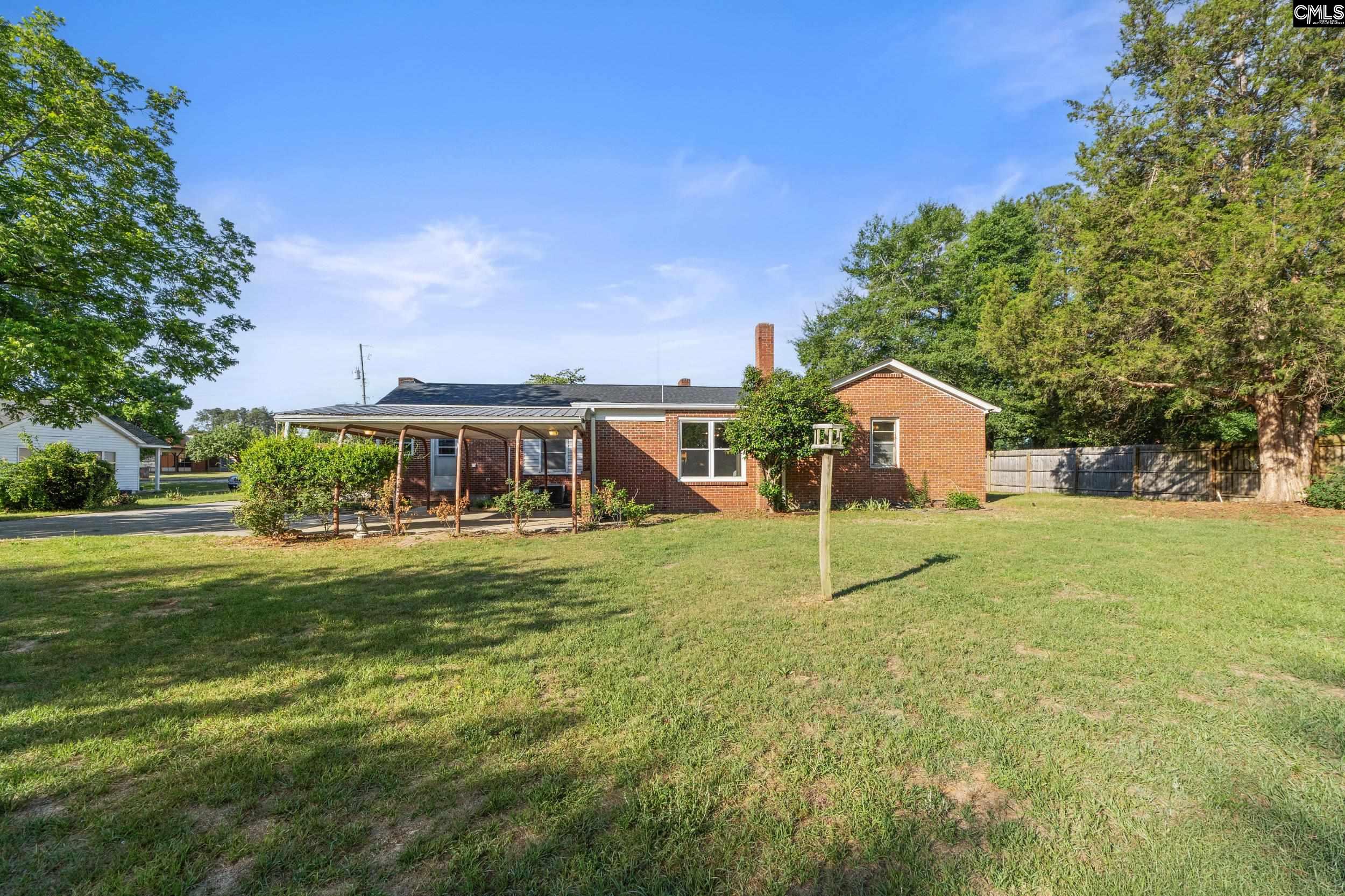 729 Magnolia Street Pelion, SC 29123 - Photo 27 of 32 a view of a house with a yard balcony and tree